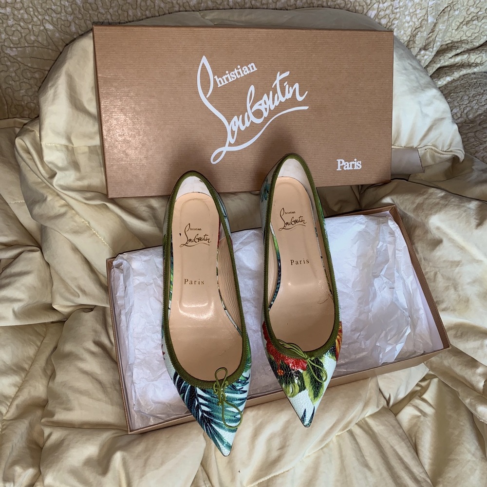 Christian Louboutin flat shoe with floral design.